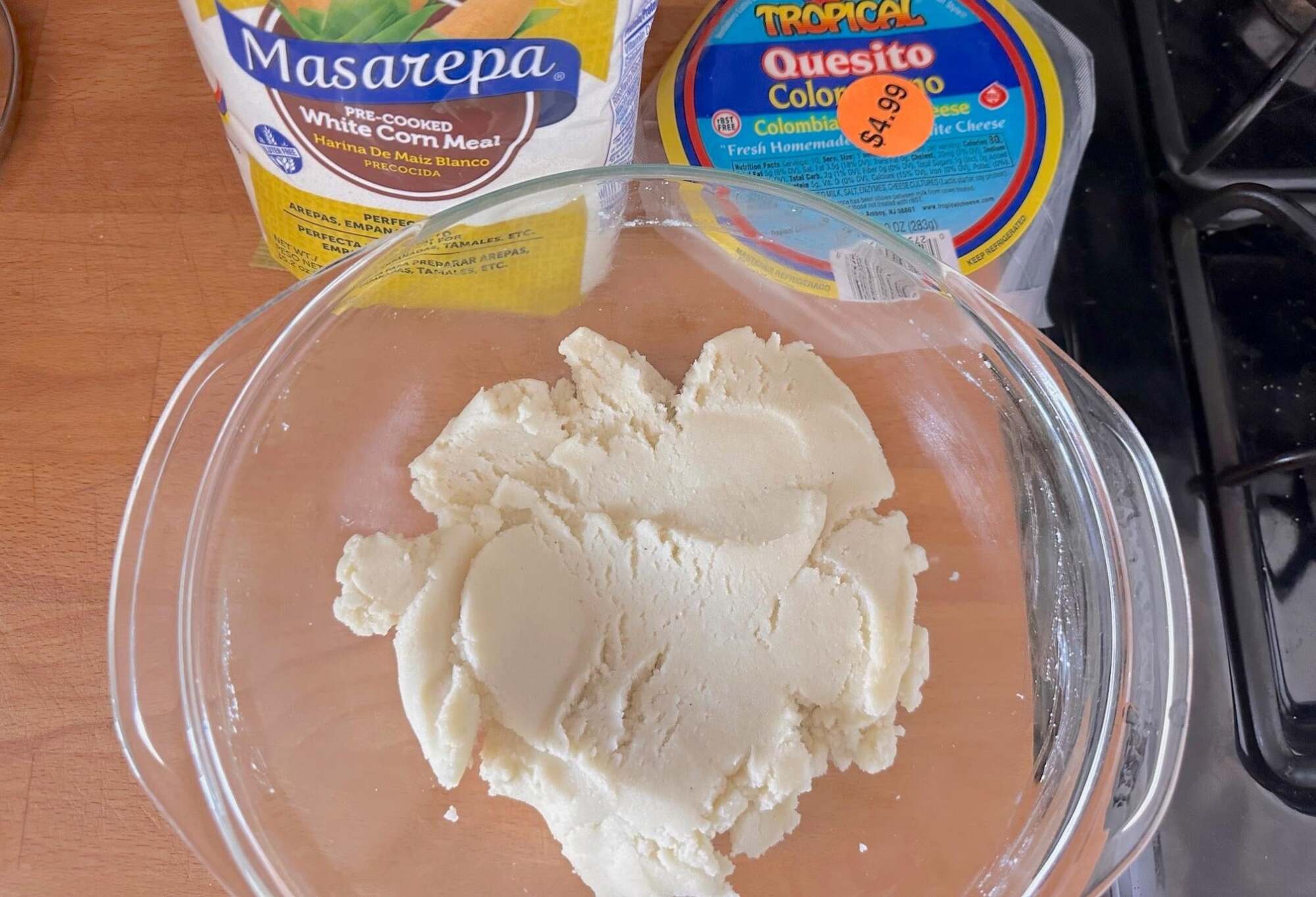 Arepa dough in a bowl before shaping.