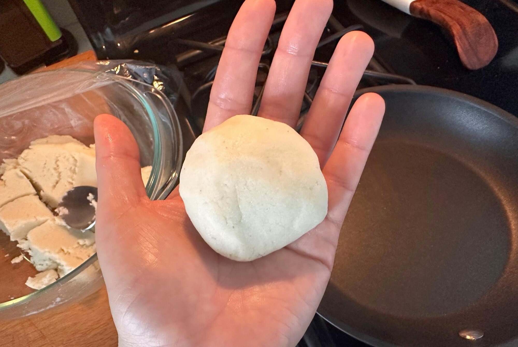 Arepa dough rolled into a ball.