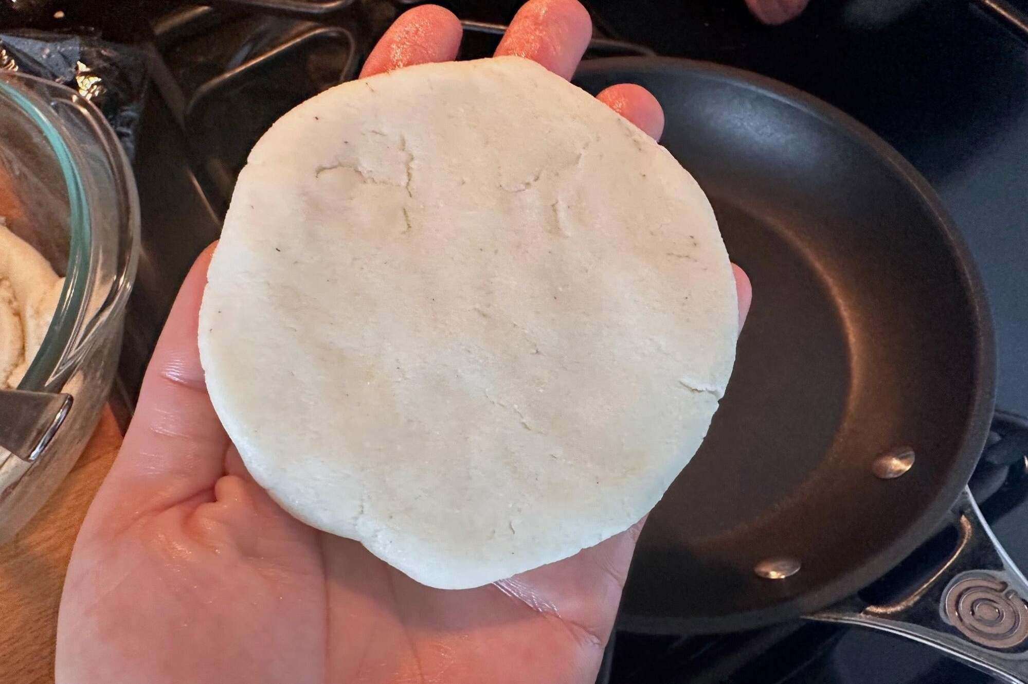 Arepa flattened and ready to toast.