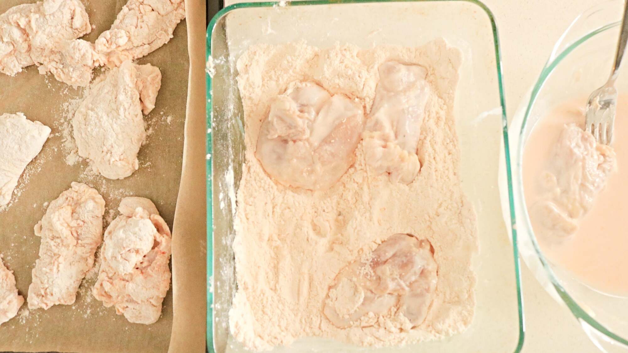 Three dishes with different ingredients for breading chicken.