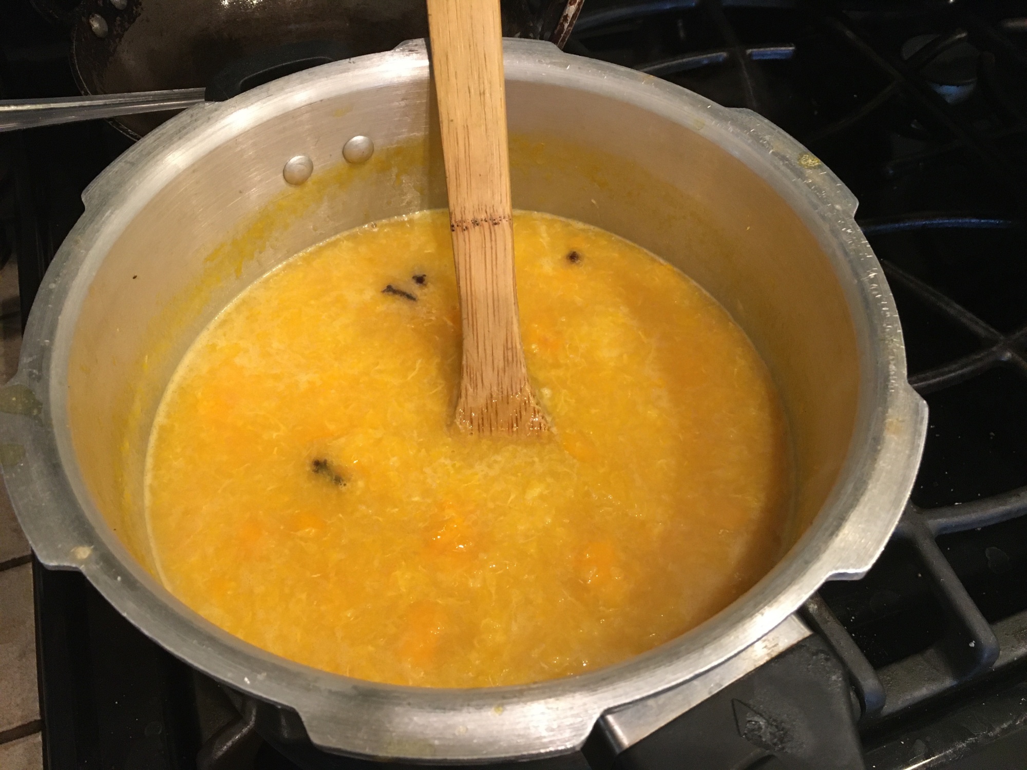 orange marmalade cooking in a pot