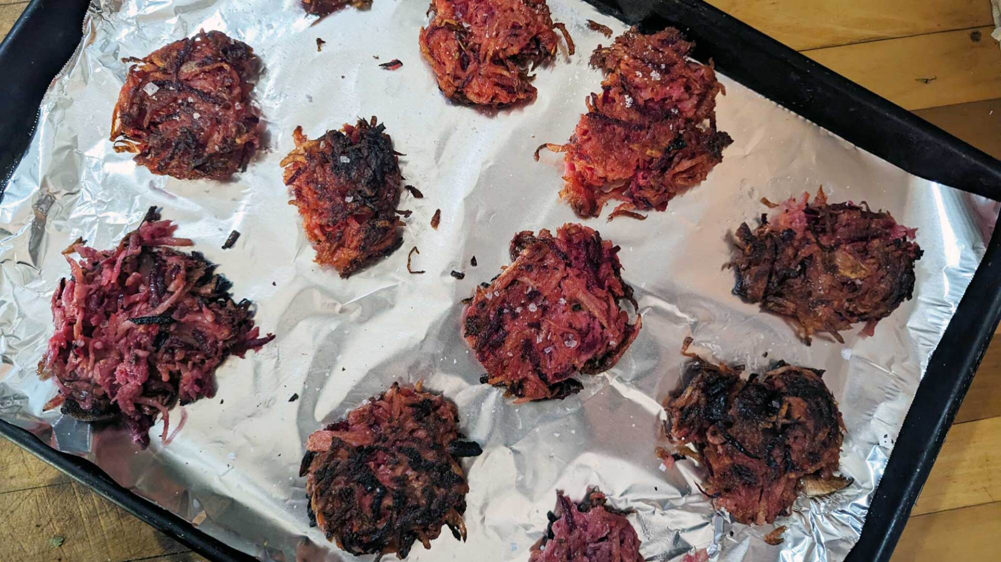 image of red flannel latkes on a cookie sheet 