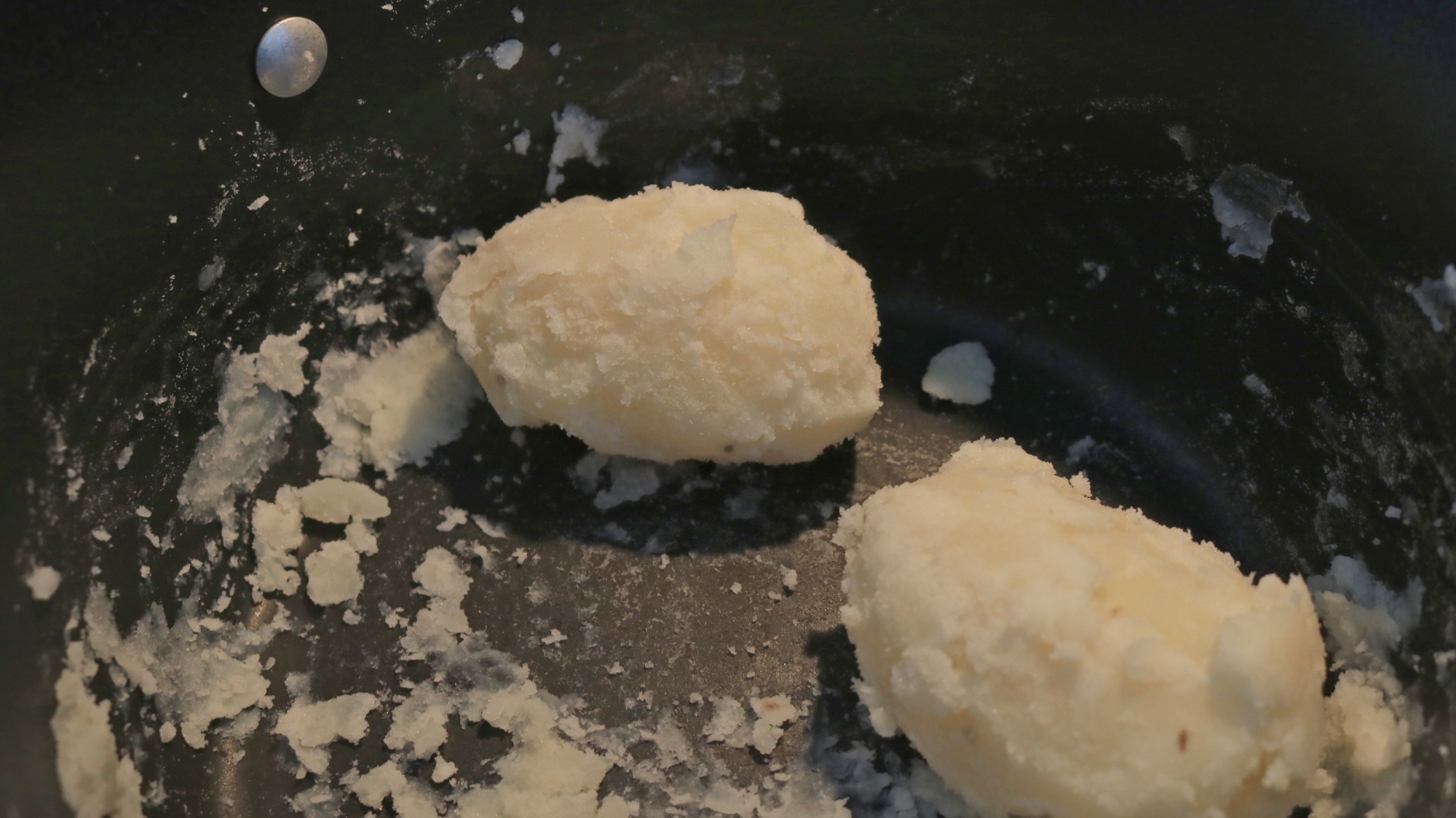 Banged-up potatoes in a pot