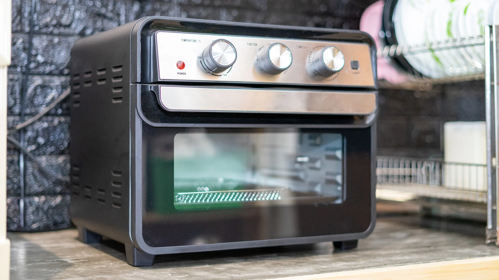 An air fryer oven sitting on the counter.