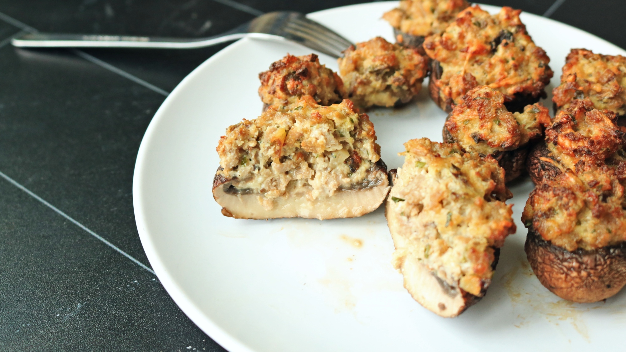 Mushroom cut in half on a plate.