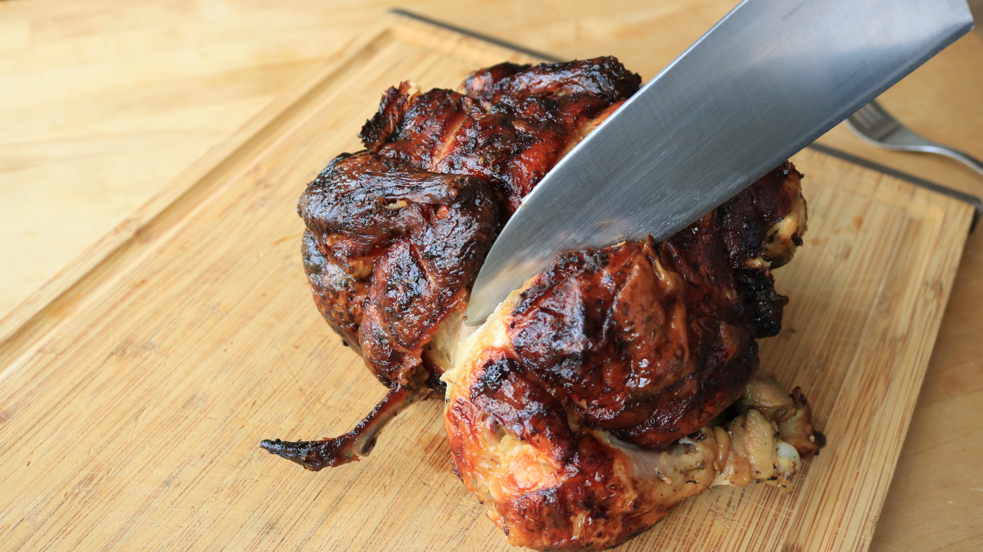 A knife carving a chicken.