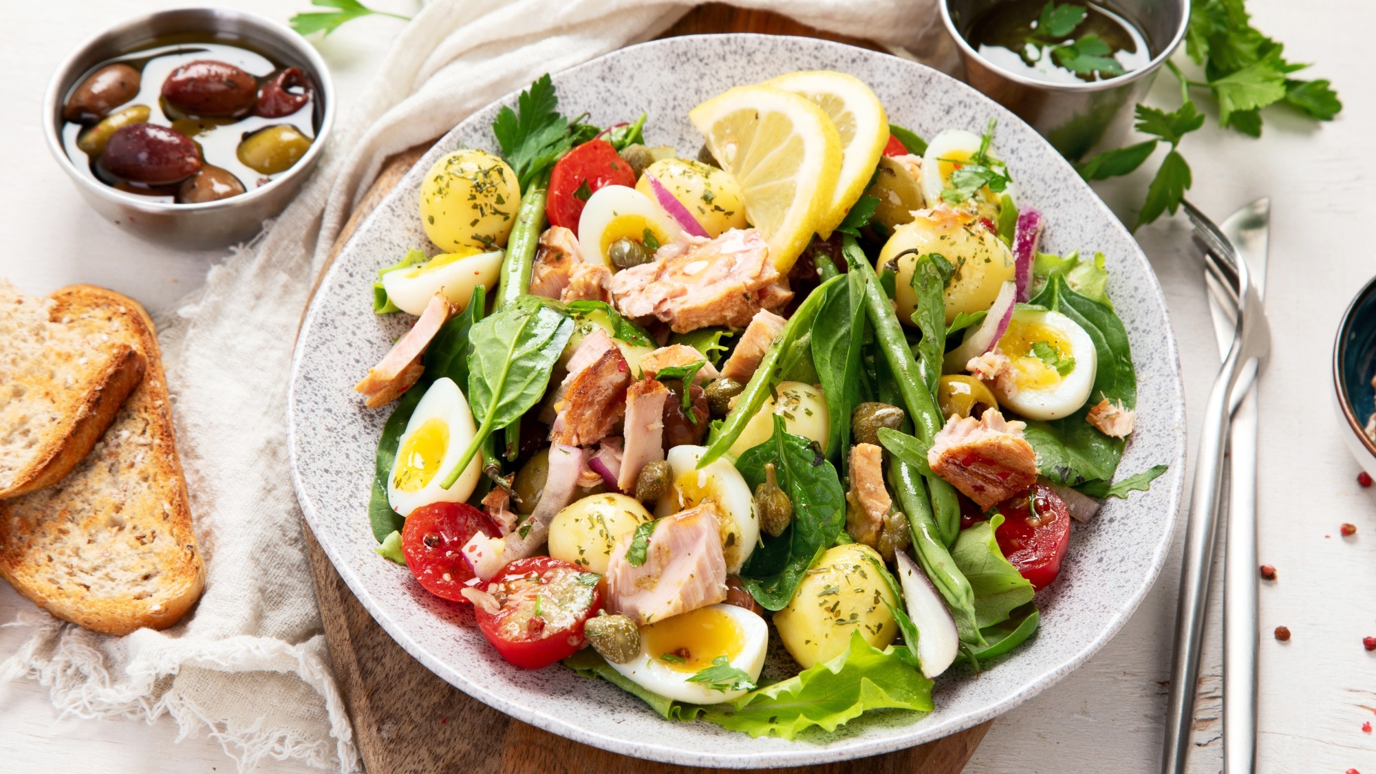 A nicoise salad on a table.