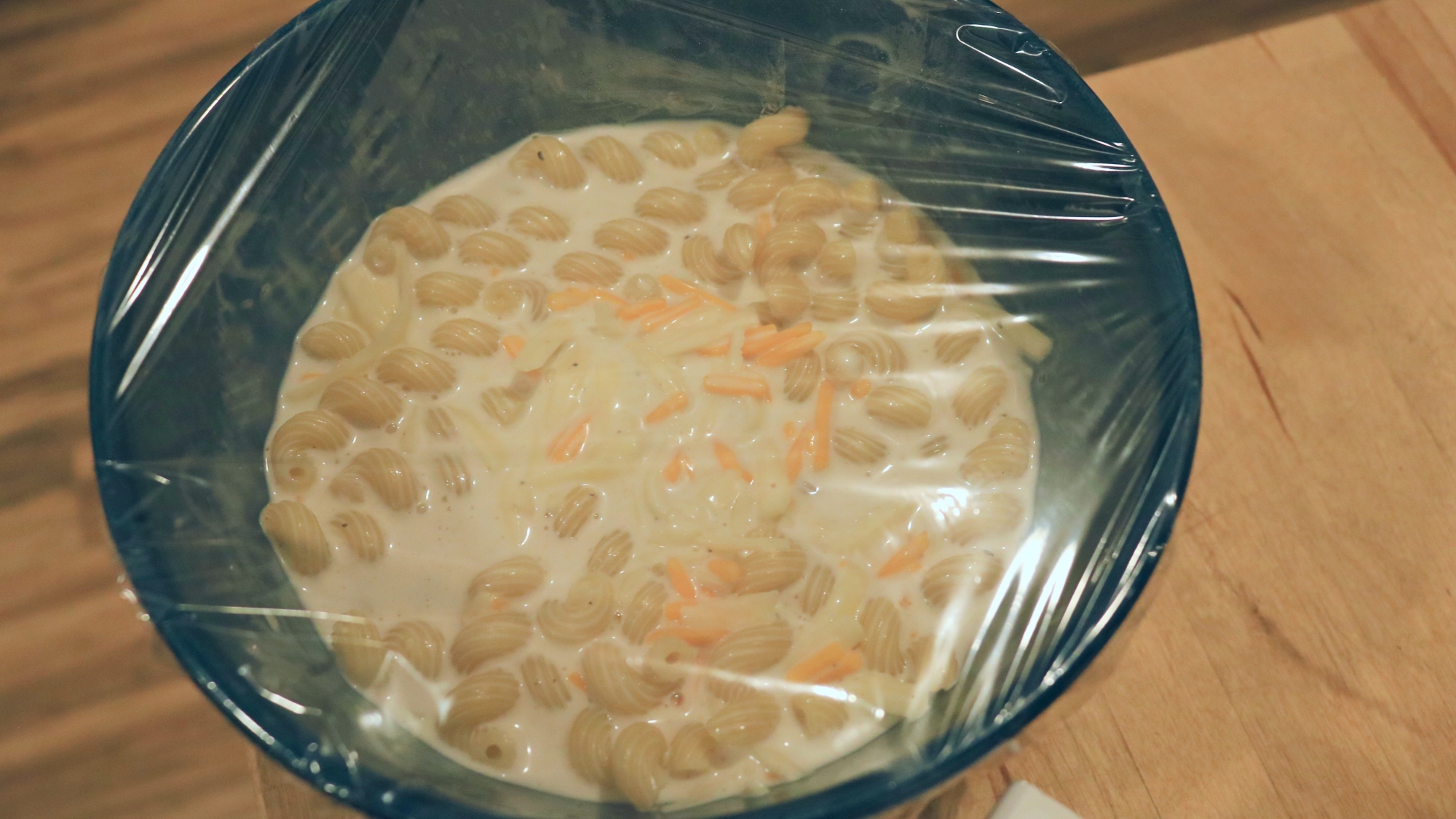 Mac and cheese in a bowl with cream.