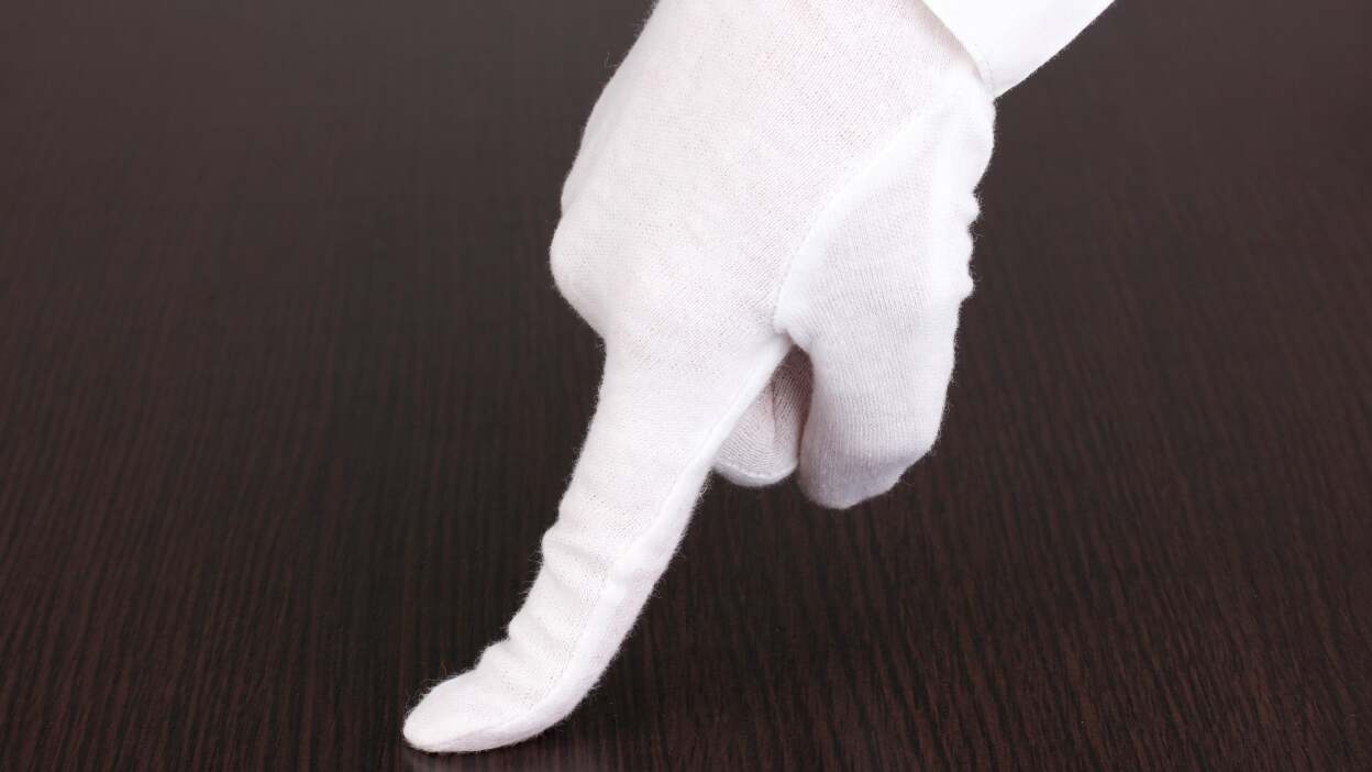 Dust small spaces with cotton gloves