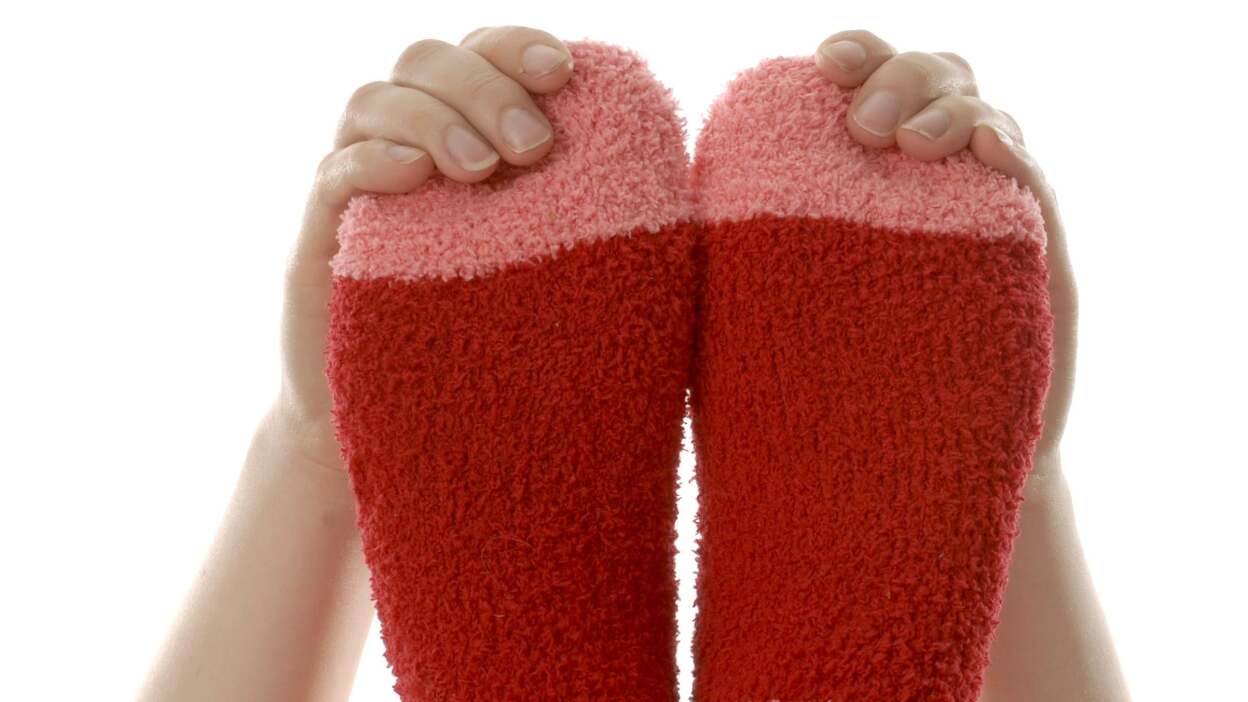 Use fuzzy socks to dust your floors